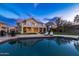 Resort-style pool with travertine decking and ample space for outdoor seating and dining under the stars at 16646 S 16Th St, Phoenix, AZ 85048