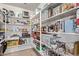 Walk-in pantry featuring shelving for optimal storage at 17574 W Corrine Dr, Surprise, AZ 85388