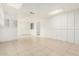 A spacious basement with tile flooring, paneled walls, and good lighting at 1817 W Claremont St, Phoenix, AZ 85015