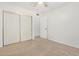 Bedroom featuring carpeted flooring and a large closet with sliding doors at 1817 W Claremont St, Phoenix, AZ 85015