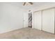 Carpeted bedroom featuring a ceiling fan and a large closet at 1817 W Claremont St, Phoenix, AZ 85015