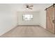 Bedroom with a window and carpet floors at 1817 W Claremont St, Phoenix, AZ 85015