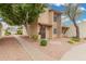 Charming home with secure doors, well-maintained landscape, and a paved walkway at 1817 W Claremont St, Phoenix, AZ 85015