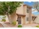 Front exterior of a two-story home with manicured landscaping, providing curb appeal at 1817 W Claremont St, Phoenix, AZ 85015