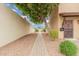 Charming townhome entrance with desert landscaping and a brick walkway leading to the front door at 1817 W Claremont St, Phoenix, AZ 85015