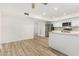 Open concept kitchen with stainless steel appliances, white cabinets and stylish countertop at 1817 W Claremont St, Phoenix, AZ 85015