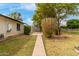 Spacious backyard featuring a concrete patio, lush greenery, and a peaceful setting perfect for outdoor enjoyment at 1824 W State Ave, Phoenix, AZ 85021