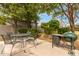 Outdoor dining area with a barbecue grill, ideal for entertaining in the private backyard at 1824 W State Ave, Phoenix, AZ 85021