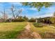 Spacious backyard featuring garden boxes and a covered patio, ideal for outdoor living at 1824 W State Ave, Phoenix, AZ 85021