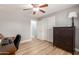 Bedroom featuring wood-look floors, a computer desk, and a dresser at 1824 W State Ave, Phoenix, AZ 85021