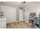 Bedroom featuring wood-look floors, closet space, and soft lighting at 1824 W State Ave, Phoenix, AZ 85021