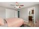 Bedroom featuring wood-look floors and a view of the attached bathroom at 1824 W State Ave, Phoenix, AZ 85021