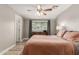 Comfortable bedroom featuring wood-look floors, soft lighting, and neutral walls at 1824 W State Ave, Phoenix, AZ 85021