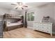 Bedroom featuring wood-look floors, a bunk bed, and a dresser at 1824 W State Ave, Phoenix, AZ 85021