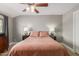 Bedroom featuring wood-look floors, soft lighting, and neutral walls at 1824 W State Ave, Phoenix, AZ 85021