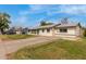 Lovely single-story home showcasing a well-maintained yard and painted white brick exterior at 1824 W State Ave, Phoenix, AZ 85021