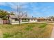 Charming single-story home showcasing a well-maintained front yard and white brick exterior at 1824 W State Ave, Phoenix, AZ 85021