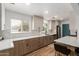 Modern kitchen with stainless steel appliances, breakfast bar, and bright natural light at 1824 W State Ave, Phoenix, AZ 85021