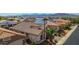 An aerial view of this single-story home with desert landscaping and mountain views at 18259 W Buena Vista Dr, Surprise, AZ 85374