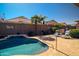 Refreshing pool set amid lush, desert landscaping with a nearby outdoor seating area creates a relaxing and private backyard at 18259 W Buena Vista Dr, Surprise, AZ 85374