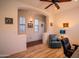 Bedroom showcasing wood floors, a ceiling fan, and an alcove at 18259 W Buena Vista Dr, Surprise, AZ 85374