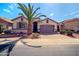 Charming single-story home with well-manicured landscaping and a two-car garage at 18259 W Buena Vista Dr, Surprise, AZ 85374