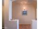 Hallway features stylish decor, sconce lighting, and tile flooring at 18259 W Buena Vista Dr, Surprise, AZ 85374