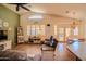 A well-lit living room features stylish furnishings and a view of the outdoor patio at 18259 W Buena Vista Dr, Surprise, AZ 85374