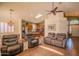 Bright living room featuring an open layout that connects the dining area and kitchen at 18259 W Buena Vista Dr, Surprise, AZ 85374