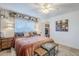 Comfortable bedroom featuring a large bed, ceiling fan, and view of the closet at 1849 E 2Nd Pl, Mesa, AZ 85203