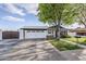 Charming single-story home with well-manicured lawn and a spacious two-car garage and stylish finishes at 1849 E 2Nd Pl, Mesa, AZ 85203