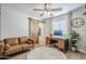 Cozy home office space features a couch, wood desk, and decorative sliding barn door at 1849 E 2Nd Pl, Mesa, AZ 85203