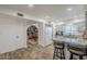 Bright, open kitchen with white cabinets and granite countertops leading to dining area at 1849 E 2Nd Pl, Mesa, AZ 85203