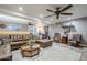 Stylish living room featuring a leather sectional, plush rug, and contemporary decor at 1849 E 2Nd Pl, Mesa, AZ 85203