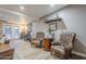 Cozy living room featuring leather armchairs, stylish decor, and a view of the outdoor space at 1849 E 2Nd Pl, Mesa, AZ 85203