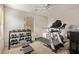 A well-equipped home gym featuring a treadmill, weights, and exercise bike for a complete workout at 18537 W Mariposa Dr, Surprise, AZ 85374