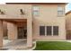 Back of home view with fenced yard and covered patio area to enjoy outdoor living at 18537 W Mariposa Dr, Surprise, AZ 85374