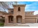 Charming two-story home with a well-maintained front yard and covered entryway, plus a two car garage at 18537 W Mariposa Dr, Surprise, AZ 85374