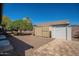 The backyard features a storage shed, block wall, mature trees and pavers at 19861 S 191St St, Queen Creek, AZ 85142