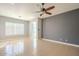 Comfortable bedroom with neutral walls, tile flooring, window with shutters and a ceiling fan at 19861 S 191St St, Queen Creek, AZ 85142