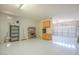 Spacious three car garage featuring sealed concrete floors, cabinets and overhead lighting at 19861 S 191St St, Queen Creek, AZ 85142