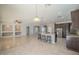 Open-concept kitchen flowing into the living area, featuring a large island and modern appliances at 19861 S 191St St, Queen Creek, AZ 85142