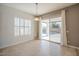 Bright living area with tile flooring, sliding glass doors to the pool, and a neutral color palette at 19861 S 191St St, Queen Creek, AZ 85142