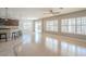 Bright and airy living room featuring an open layout and an island with barstool seating at 19861 S 191St St, Queen Creek, AZ 85142