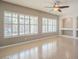 Bright living room with plantation shutters on the windows and custom built-in shelving and cabinetry at 19861 S 191St St, Queen Creek, AZ 85142