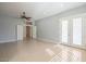 Open-concept living area with tile floors and a door leading to the backyard at 19861 S 191St St, Queen Creek, AZ 85142