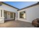 Covered patio area with neutral tones, offering an inviting outdoor space for relaxation and entertainment at 19861 S 191St St, Queen Creek, AZ 85142