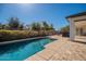 Backyard view of the pool, patio, and beautiful landscaping of the property at 19861 S 191St St, Queen Creek, AZ 85142