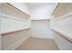 This walk-in closet is equipped with shelving and closet rods for optimal storage at 19861 S 191St St, Queen Creek, AZ 85142