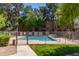 Gated community pool with a lawn at 200 E Southern Ave # 173, Tempe, AZ 85282